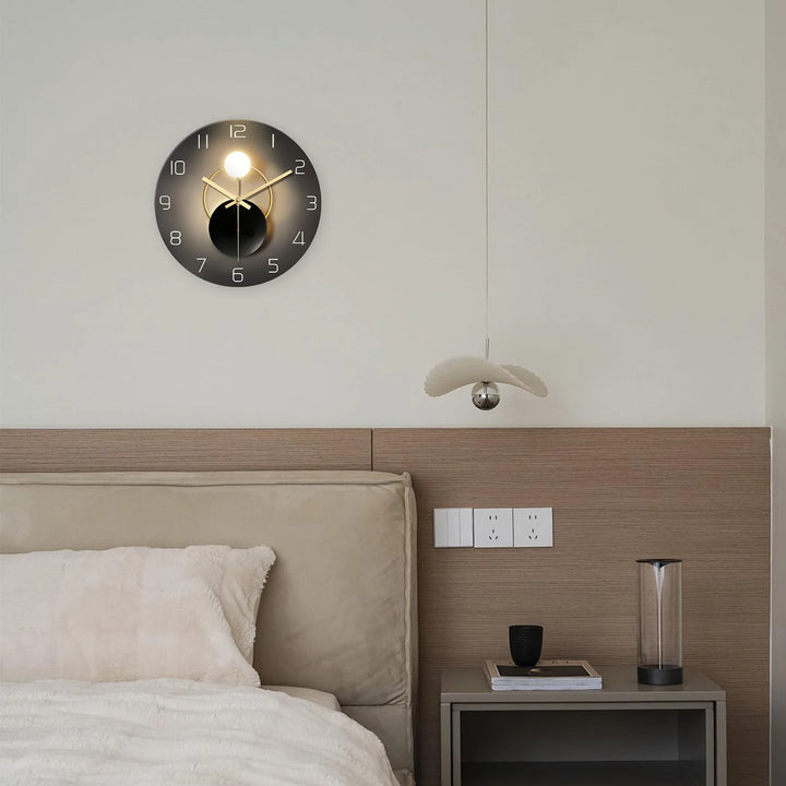 Modern bedroom with a wall clock, bed, and nightstand.