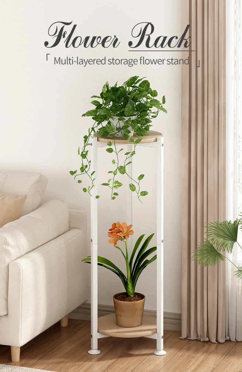 White multi-layered storage flower stand with plants in a living room setting.