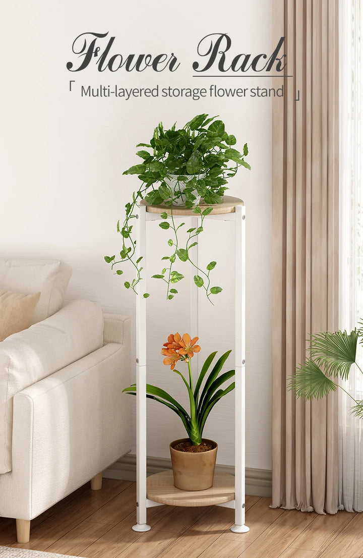 White multi-layered storage flower stand with plants in a living room setting.