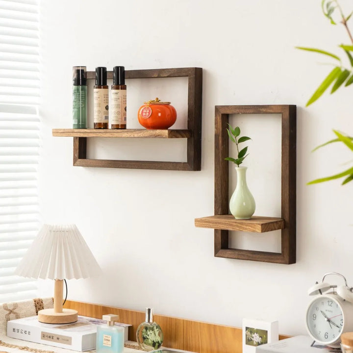 Wooden wall shelves with decorative items against a white wall.